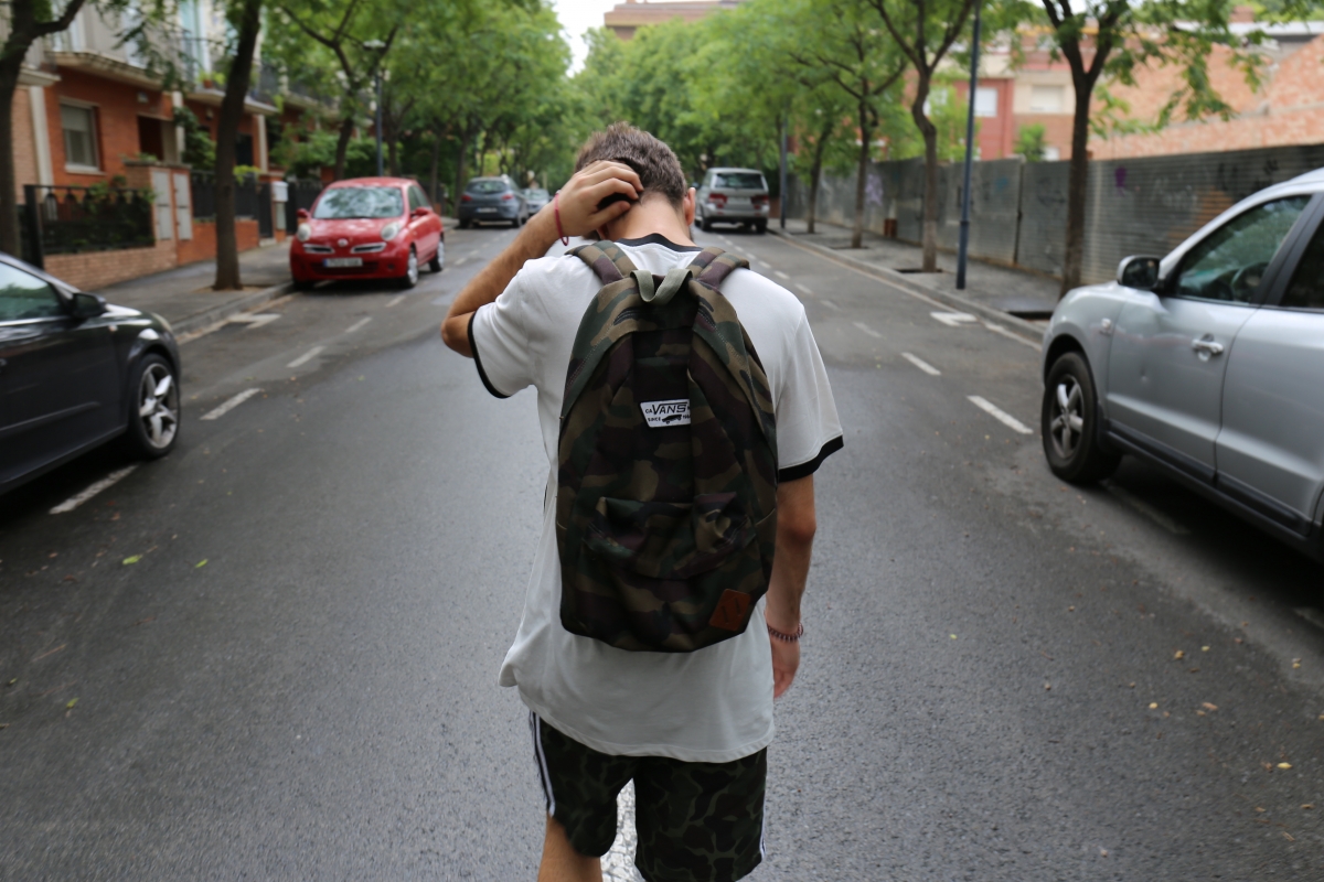 Young person walking on the road